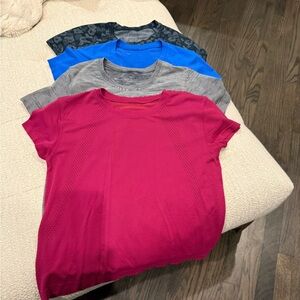 Set of Four Short Sleeve shirts from lululemon.